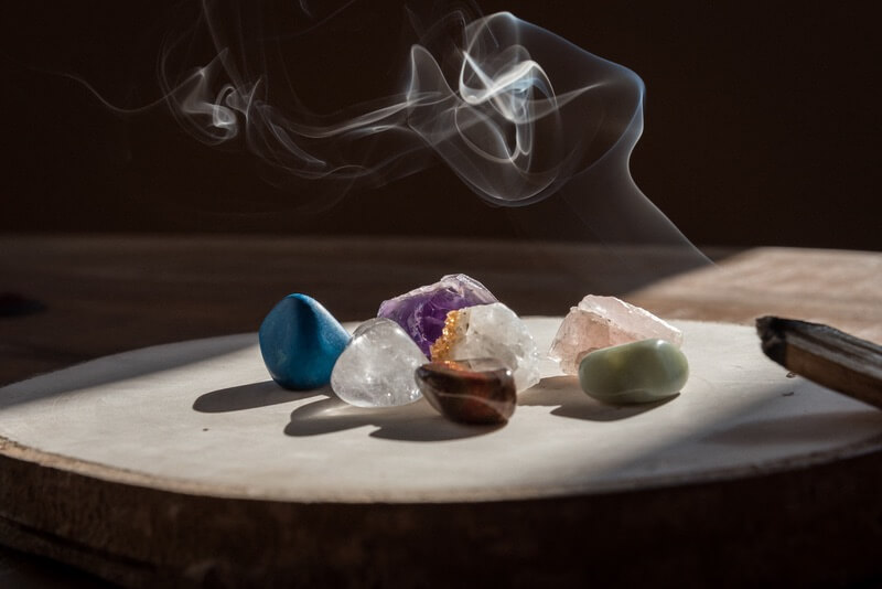 Some crystals being cleansed with incense