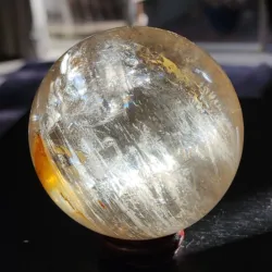 Clear quartz crystal ball with lovely light reflections in the internal struicture