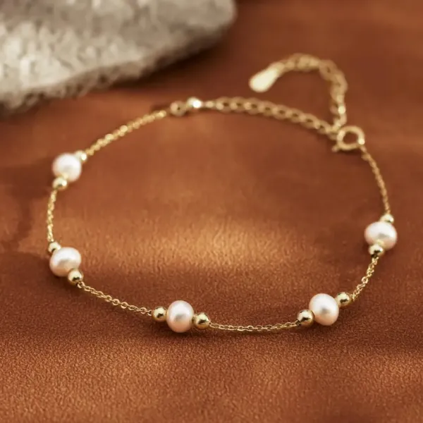 Dainty Round Pearl Bracelet - five pearls with golden beads connected with golden chain.