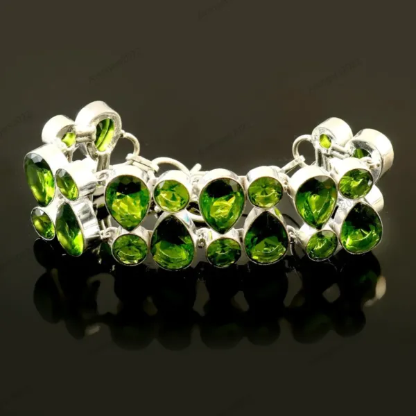 Handmade green Peridot silver Bracelet on black mirror-like background