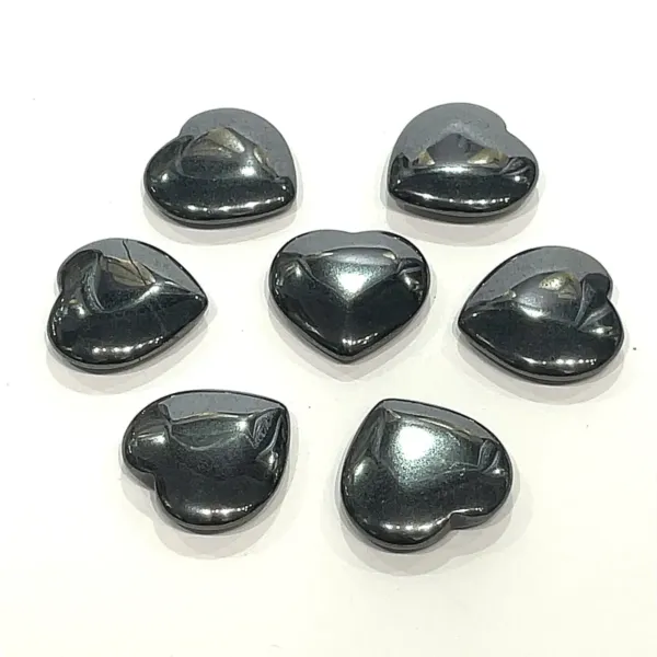 A group of Hematite heart stones on white background