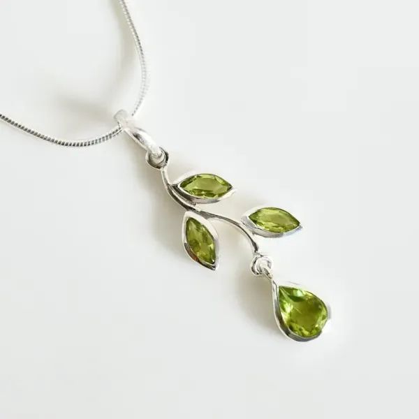 Leaf Peridot Pendant with four green stones.