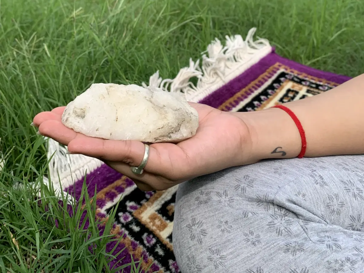 Meditating with white quartz - crystals for spiritual growth