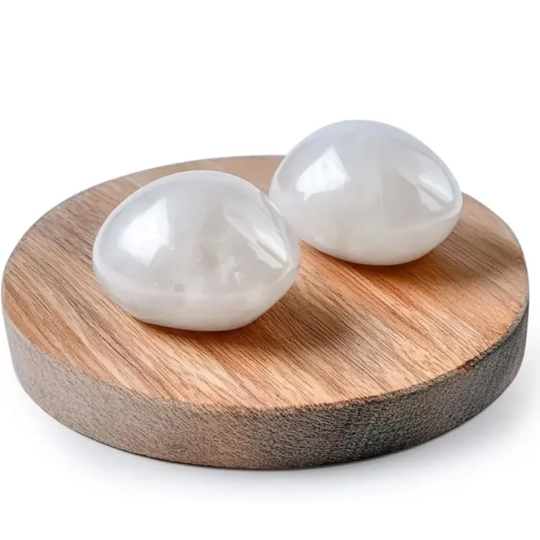 Two pieces of Milky Quartz Polished Stones on round wooden stand