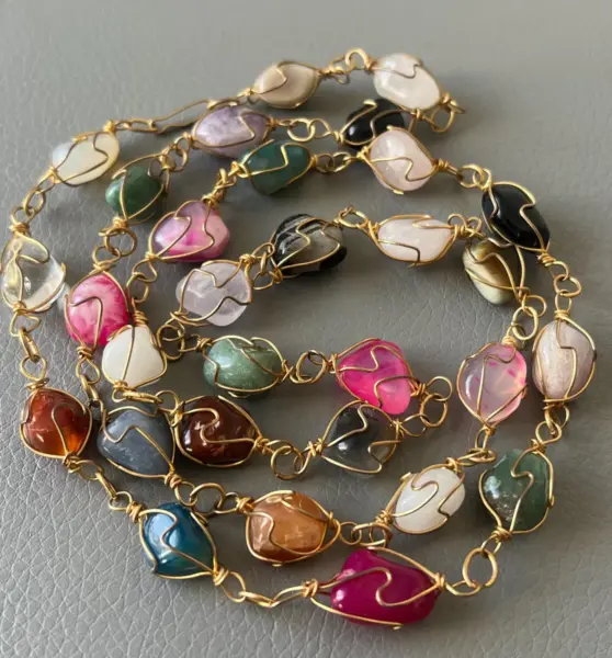Necklace of Polished Semi-Precious Multicolored Amethyst, Agate, and Carnelian Stones in a Wire Cage