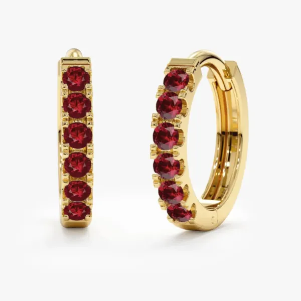 A pair of Natural Ruby Hoop Gold Earrings with six ruby crystals each
