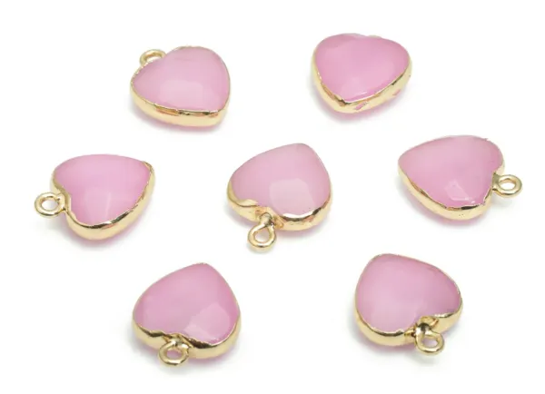 A group of Pink Jade Heart Charms on white background