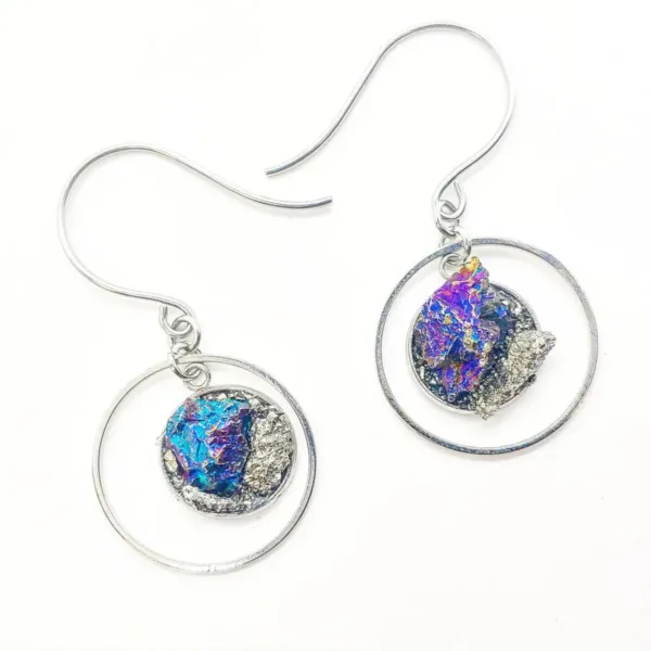 A pair of Raw peacock ore dangle round silver earrings