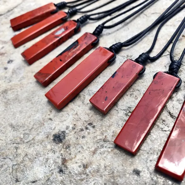 A group of various Rectangle Red Jasper Necklaces for Men and Women