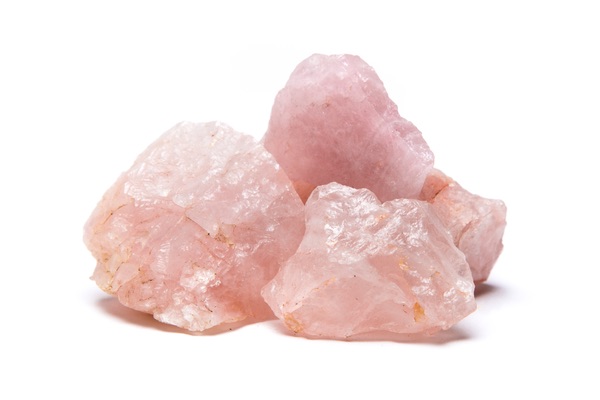 Three Rose Quartz crystals in a pile