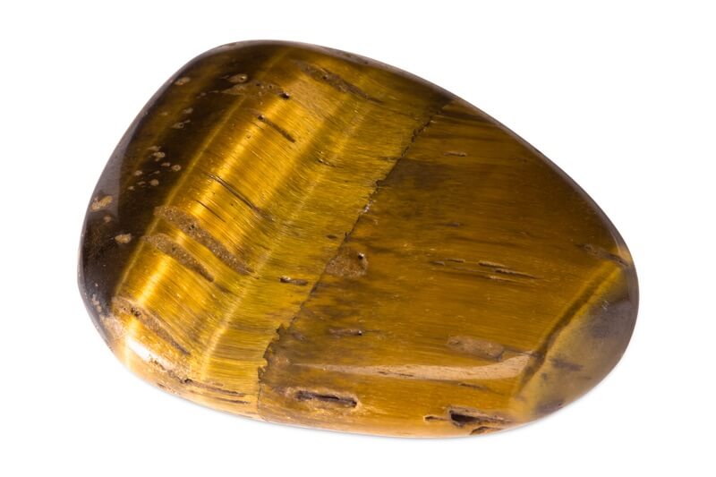 A Tiger's Eye stone that has been used for a variety of affirmations