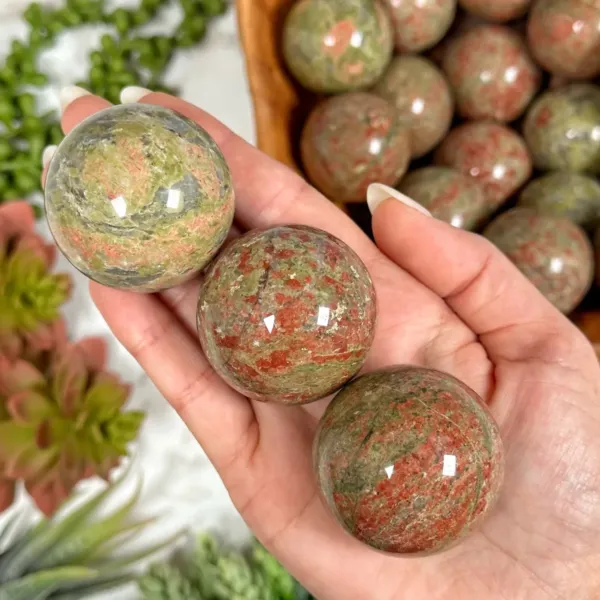 Unakite Spheres on palm of the hand