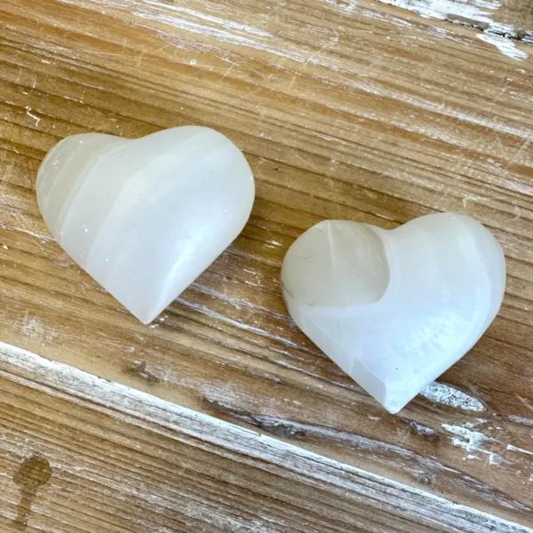 A pair of White Onyx Hearts